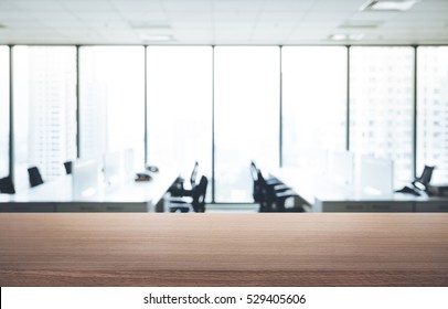 Empty wood table with blur room office and window city view background.For montage product display or design key visual layout. - Shutterstock ID 529405606