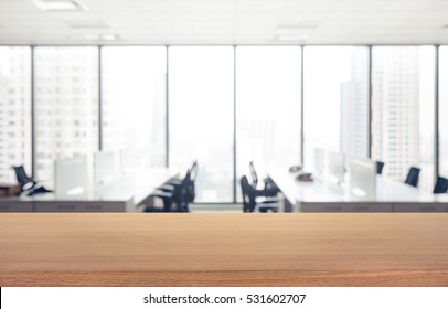 Empty wood table with blur room office and window city view background.For montage product display or design key visual layout. - Shutterstock ID 531602707