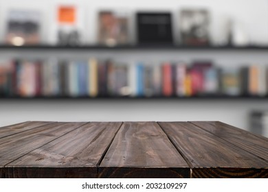 Empty Wood Table With Blurred Background Of Bookstore Or Library. For Montage Display Products.