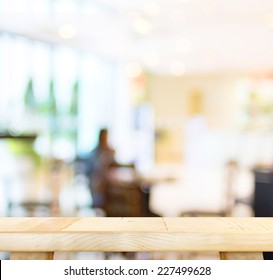 Empty Wood Table And Blurred Cafe Light Background. Product Display Template.Business Presentation