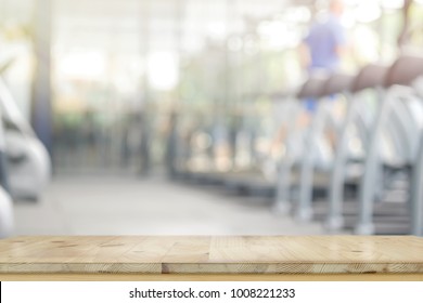 Empty Wood Table In Gym Interior Background.