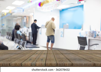 Empty Wood Table With People  In The Bank