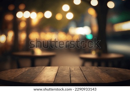 Empty wood table for product display in blur background of admirable restaurant at night