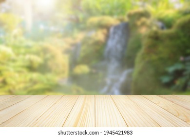 Empty Wood Table Top With Abstract Blur Park Garden Pond Background