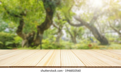 Empty Wood Table Top With Abstract Blur Park Garden Pond Background