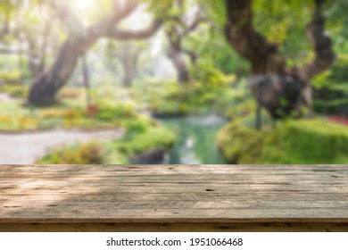 Empty Wood Table Top With Abstract Blur Park Garden Pond Background