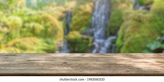 Empty Wood Table Top With Abstract Blur Park Garden Pond Background