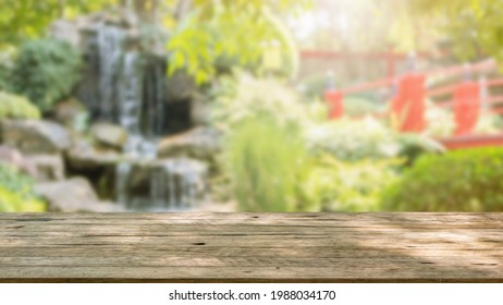 Empty Wood Table Top With Abstract Blur Park Garden Pond Background