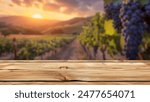 Empty wood table top with blur background of vineyard landscape in winery. The table giving copy space for placing advertising wine product on the table along with beautiful winery vineyard background