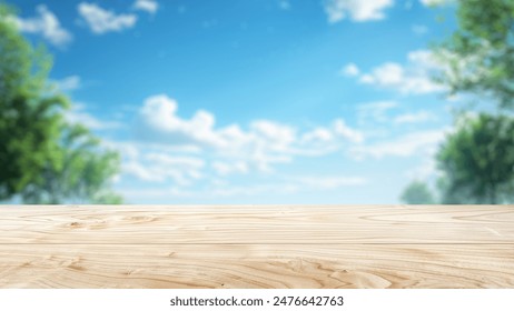 Empty wood table top with blur background of nature lush green forest. The table giving copy space for placing advertising product on the table along with beautiful green forest nature background.
