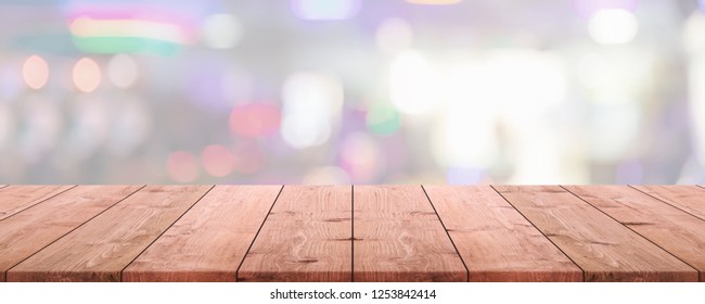 Empty wood table top and blurred restaurant interior banner background - can used for display or montage your products. - Shutterstock ID 1253842414