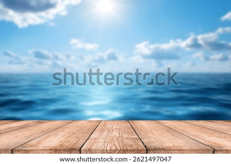 Empty wood table top and blurred summer beach with blue sea and sky banner background. - can used for display or montage your products.