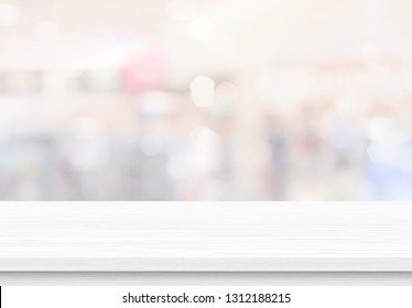 Empty Wood Table Top On Blur Abstract Background From Inside Shopping Mall. Template Mock Up For Display Of Product