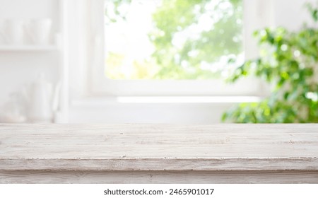 Empty wood table top on blur window sill and kitchen shelf background - Powered by Shutterstock