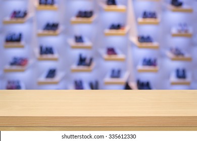 Empty Wood Table Top On Blurred Shoe Store Background - Can Montage Or Display Your Products