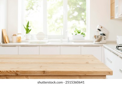 Empty wood table top view for product display montage on blur kitchen counter and wide window background