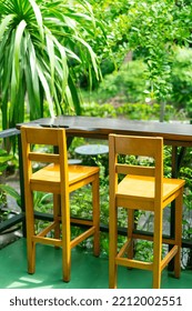 Empty Wooden Bar Stool Decoration In Garden