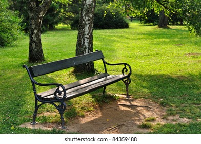 Empty Wooden Bench In The City Park