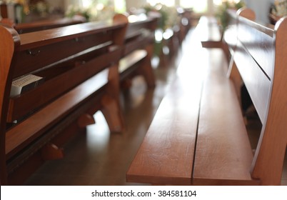 Empty Wooden Bench On The Church