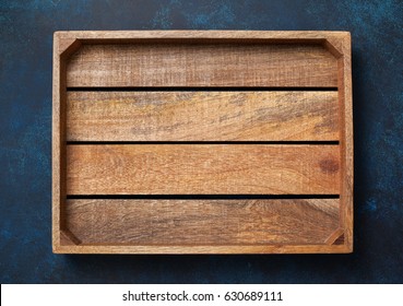 Empty Wooden Box On Blue Background. View From Above. Copy Space