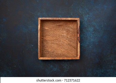 Empty Wooden Box On Blue Background. View From Above. Copy Space