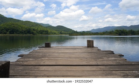 Empty wooden bridge or table top with the lake mountain and sky landscape. Wood floor with lake mountain and sky of nature park background and summer season, product display montage. - Powered by Shutterstock