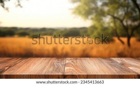 The empty wooden brown table top with blur background of Savanna Safari. Exuberant image.