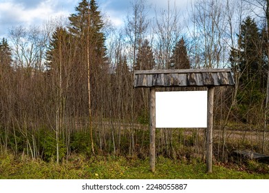 Empty wooden bulletin board outdoors with roof tiles, copy space, mockup - Shutterstock ID 2248055887