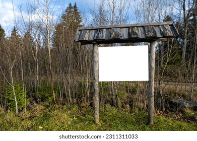 Empty wooden bulletin board outdoors with roof tiles, copy space, mockup - Shutterstock ID 2311311033