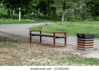 Empty Wooden Chair At Lake Garden