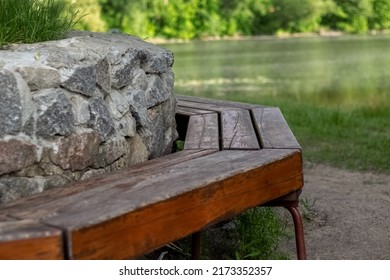 Empty Wooden Chair At Lake Garden