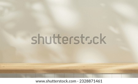 Empty wooden countertop mock up to present product and for text design. background summer mock up with tree and leafs shadows and sunlight from window. cozy wooden table and pastel plaster wall.