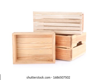 Empty wooden crates stacked and isolated on white - Powered by Shutterstock