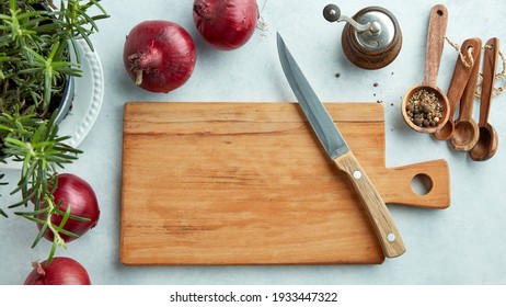 empty wooden cutting board and knife on kitchen table, top view