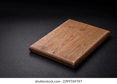 Empty wooden cutting board for preparing ingredients for preparing a delicious dish. Kitchen utensils