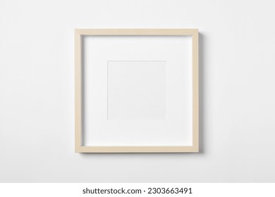 Empty wooden frame on white background. Mockup for design