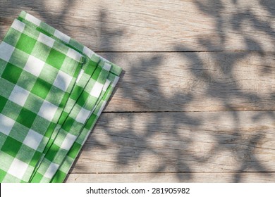 Empty Wooden Garden Table With Tablecloth. Top View With Copy Space