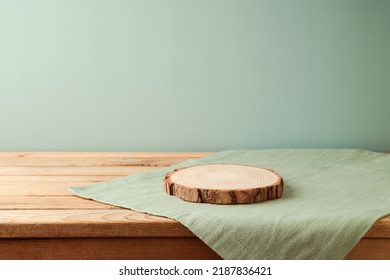 Empty wooden log on table with modern tablecloth. Kitchen mock up for design and product display