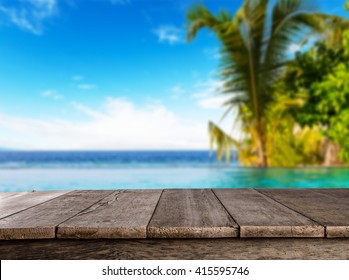 Empty Wooden Planks With Blur Beach On Background