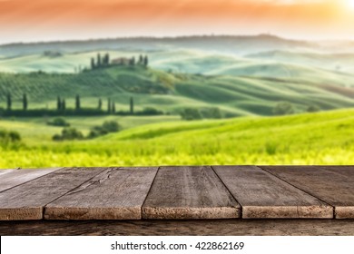 Empty wooden planks with Italian landscape on background. Ideal for product placement - Powered by Shutterstock