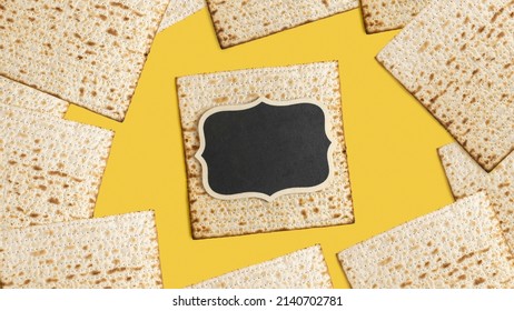 Empty Wooden Plaque And Matzah For Jewish Holiday Pesach On Yellow Background.