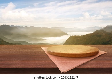 Empty wooden plate on the table with Mountain soft blurry background, of free space for your copy and branding. Use as products display montage. Vintage style concept. - Shutterstock ID 2083122247