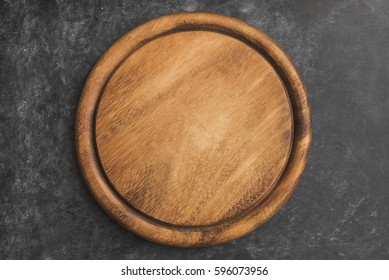 Empty Wooden Round Platter On Black Background.Top View, Copy Space.