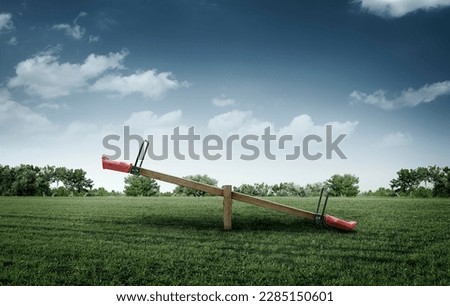 Empty wooden seesaw in a park
