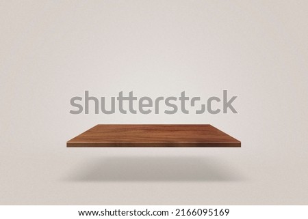 Empty wooden shelf casting a shadow on the floor. An empty space to place the advertised product