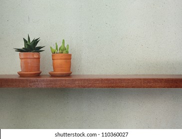 Empty Wooden Shelf On The Tile Wall.