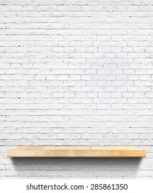 Empty Wooden Shelf At White Tile Ceramic Wall,Template Mock Up For Display Of Product,business Presentation.