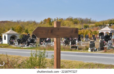 Empty Wooden Sign For The Dead To Show Them The Way Out Of Graveyard