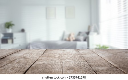 Empty Wooden Table In Baby Room Interior