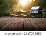 Empty wooden table and backyard garden background with grill BBQ